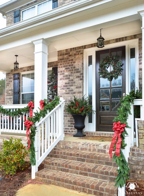 Kelley Nan: Holiday Home Showcase | 2016 Christmas Home Tour- Traditional and Classic Front Porch with Red Bows, Garland, and Urns of greenery on either side of front door Porch Garland, Christmas Front Doors, Christmas Front Porch, Front Steps, Christmas Porch Decor, Golden Gate Park, Christmas Living Rooms, Front Porch Christmas Decor, Christmas Decorations For The Home