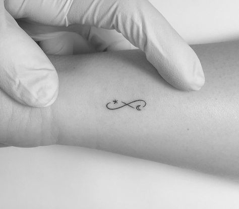 Infinity symbol with moon and star tattooed on the wrist Eternity Tattoo, Small Infinity Tattoos, Infinity Sign Tattoo, To The Moon And Back Tattoo, Tattoo Infinity, Infinity Tattoo On Wrist, Moon Star Tattoo, Tiny Tattoo Ideas, Infinity Symbol Tattoo