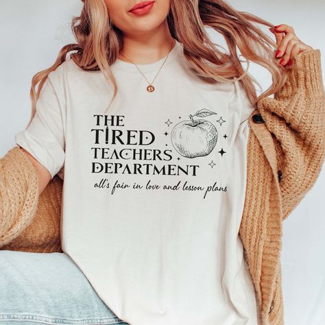 OMG, this might be my fave teacher tee this season! 😍🍎 It is trending to be a best seller! 🌟 The Tired Teachers Department Bella Graphic Tee paired with the NEW Risen Heavenly Soft Joggers is the ultimate combo for casual teaching days. 🛒 Shop now and treat yourself! 🌟 Tired Teachers Bella Tee 👖 Risen Joggers Snag this must-have outfit and rock your teacher style in comfort. You deserve it! #TeacherLife #BestSeller #GraphicTees #RisenJoggers #CasualTeachingDays #LimeberryDesigns #TeacherO... Fall In Love With Learning, Third Grade Teacher Shirts, Teacher Tired, Message For Teacher, Teacher Fits, Grading Papers, Third Grade Teacher, Soft Joggers, Modern Music