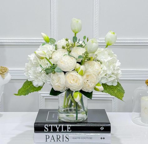 Real touch white hydrangea/Real Touch tulips/Silk off white/ ivory peonies flower arrangement ♥ White floral arrangement ♥ Original Unique design By FLOVERY This Unique Large Arrangement design features real touch white  hydrangea mixed with white tulip and artificial silk peonies.  The arrangement looks elegant and realistic that you cannot tell the different with fresh flower arrangement. This romantic style can be used for both classic and contemporary luxury home decor,  large dining table, White Flower Table Arrangements, Peonies Flower Arrangement, White Hydrangea Centerpiece, Ivory Peonies, Ranunculus Centerpiece, White Rose Centerpieces, White Hydrangea Centerpieces, Peony Flower Arrangements, Faux Arrangements