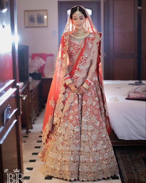 This gorgeous indian bride wearing a classic red embroidered Anamika Khanna lehenga with a heavy scalloped border dupatta. PC: The Badal Raja Company #indianwedding #wedding #lehenga #indianjewellery #jewelry #bridaljewellery #bridalmakeup #bridal #indianbride #indianbridaljewellery #makeup #wittyvows Bridal Lehenga Red Royal Heavy, Anamika Khanna Bridal Lehenga, Bridal Lehenga Red Royal, Anamika Khanna Bridal, Anniversary Outfits, Dupatta Draping, Peacock Mehndi, Baju Kahwin, Anniversary Outfit