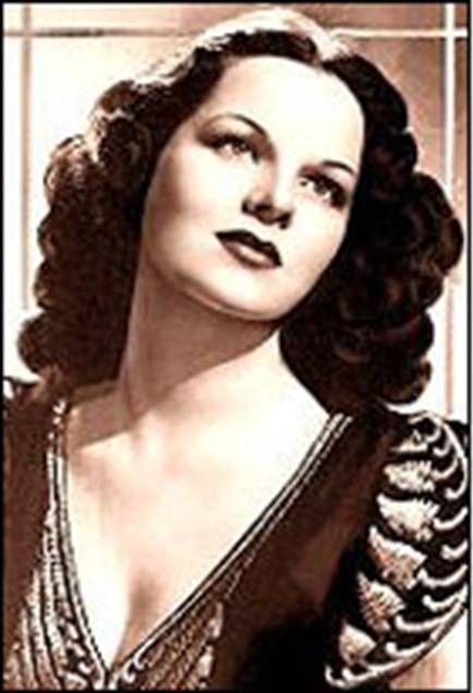 Virginia Hill (1916-1966) was one of the most famous female mobsters. She was a courier for the national crime syndicate, moving thousands of dollars from one mobster to the next, even overseas. She purportedly slept with many gangsters, but was Bugsy Siegel's girlfriend.  She fled to Austria after the Government went after her for tax evasion.  She died on the ski slopes of Salzburg, Austria after ingesting a heavy dose of sleeping pills. She was 49 years old. Bugsy Siegel, Virginia Hill, Real Gangster, Mafia Gangster, Mafia Families, Wise Guys, Al Capone, Goodfellas, The Girlfriends