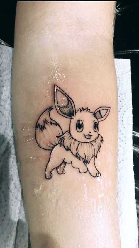 Pokemon Tattoo Evie, Simple Eevee Tattoo, Pokemon Tattoo Cute, Eevee Tattoo Ideas, Evee Tattoos, Eevee Tattoo Design, Pokemon Minimalist Tattoo, Tattoo Ideas Pokemon, Eevee Pokemon Tattoo