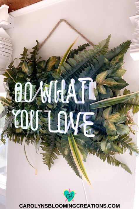 Framed Neon Sign, Faux Plant Wall With Neon Sign, Neon Signs Office Space, Diy Neon Backdrop, Neon Sign Wall Ideas, Hanging Neon Sign, Garden Neon Sign, Neon Sign In Office, Neon Plant Sign