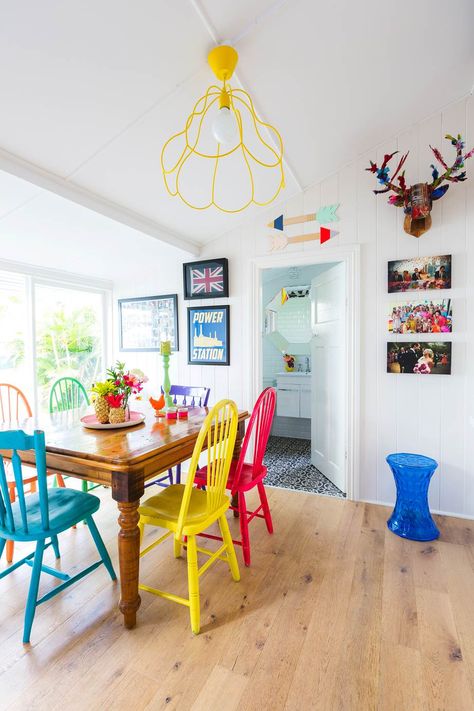 A Brisbane couple transform a character-filled Queenslander-style cottage, which was in desperate need of an renovation. Take a look inside! Dining Table With Different Color Chairs, Colorful Dining Room Chairs, Colorful Kitchen Tables, Painting Kitchen Chairs, Painted Chairs Dining Room, Colored Dining Chairs, Traditional Dining Chairs, Woven Dining Chairs, Painted Dining Chairs