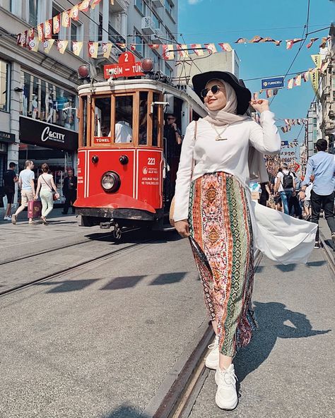 Instagram: @hanaahany_ 🔮 Bohemian maxi skirt , patterned boho skirt. White sneakers, chiffon blouse , maxi back blouse , black hat , Istanbul, istiklal street , tram , travel photography, hijab fashion , modest outfits Skirt White Sneakers, Photography Hijab, Istiklal Street, Maxi Skirt Pattern, Bohemian Outfits, Bohemian Maxi Skirt, Hijab Fashion Summer, Outfits Hijab, Hijab Wedding