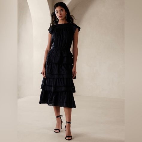 A Touch Of Romance, This Charming Tiered Midi Dress Employs A Soft Cotton Voile Silhouette Layered With Fluttering Tiers And Elegant Lace Accents For Subtle, Mesmerizing Movement. Sheer Swing Fit: Cut For A Flowing, A-Line Fit. No Waist Definition. Crew Neck With Interior Back Button And Look. Side Zip Closure At Wearer's Left. #579048 Swing Fit. Sleeveless. Midi Length. Body Length (Size S): Regular 49" Model: Size S, 5'10" (178cm). 100% Cotton. Lining: 100% Viscose Rayon. Machine Wash. Importe Black Cotton Dresses, Embroidered Midi Dress, Romantic Lace, Tiered Midi Dress, Pleated Midi Dress, Versatile Dresses, Banana Republic Dress, Knit Midi Dress, Cotton Voile