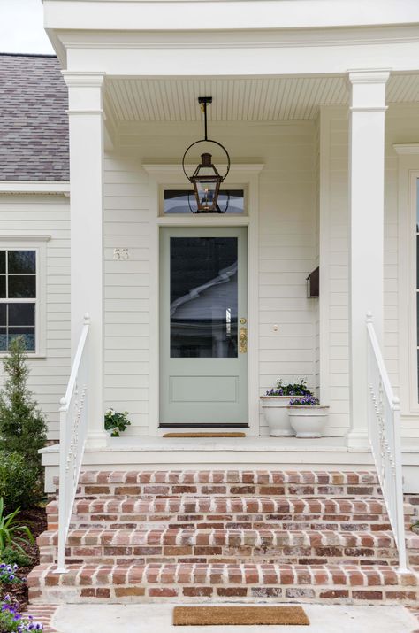 Exterior Door Transom, Cottage Front Exterior, Single Front Door With Transom, Renovated Cottage Exterior, Exterior Door No Window, Exterior Door With Transom Window, Tan House With Blue Door, Exterior House Colors Single Story, Exterior Lanterns Front Door