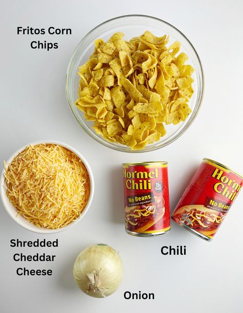 Sometimes you just need a little Frito Chili Pie and that's all there is to it. Here's your easy recipe! And I do mean EASY. #fritos #chili #supper #fritochilipie #framedcooks #kidfriendly Pepper Bellies Fritos, Frito Meals, Fritos And Chili, Walking Chili Fritos, Frito Pie With Canned Chili, Easy Frito Chili Pie, Chili Frito Pie Recipe Easy, Frito Pie Recipe With Canned Chili, Frito Chili Pie Recipe Easy