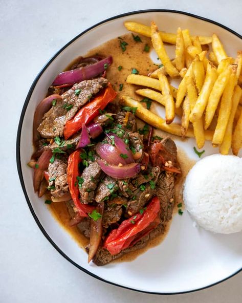 Lomo Saltado Recipe (Peruvian Beef Stir-Fry) | Kitchn Lomo Saltado Recipe Peruvian, Lomo Saltado Recipe, Peruvian Beef, Beef Loin, Peruvian Dishes, Lomo Saltado, Peruvian Cuisine, Easy Healthy Lunches, Peruvian Recipes