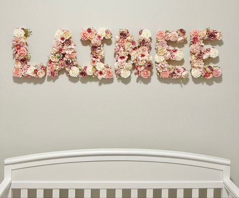 Pink Rose Nursery, Name On Nursery Wall, Girl Nursery Changing Table, Crib Closet, Blanket Ladder Nursery, Red Nursery Girl, Flower Nursery Baby Girl, Diy Name Signs For Nursery, Pastel Flower Nursery