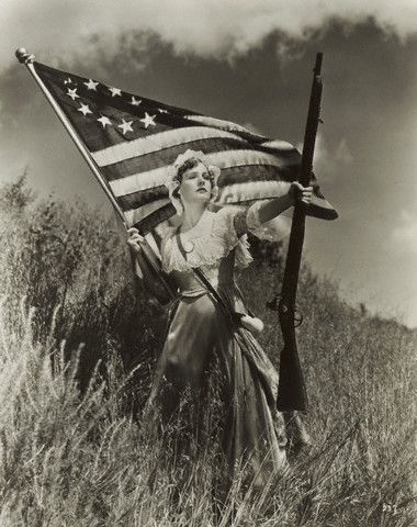 Madge Evans (1914-1971) posing as a revolutionary heroine, 1935. She is holding one of the earliest American flags with the stars in a circular pattern. Holding A Flag Pose Reference, Holding Flag Pose Drawing, Ukraine Drawing, Flag Folding, Moving Poses, Heroic Pose, Patriotic Photos, Old America, 4th Amendment