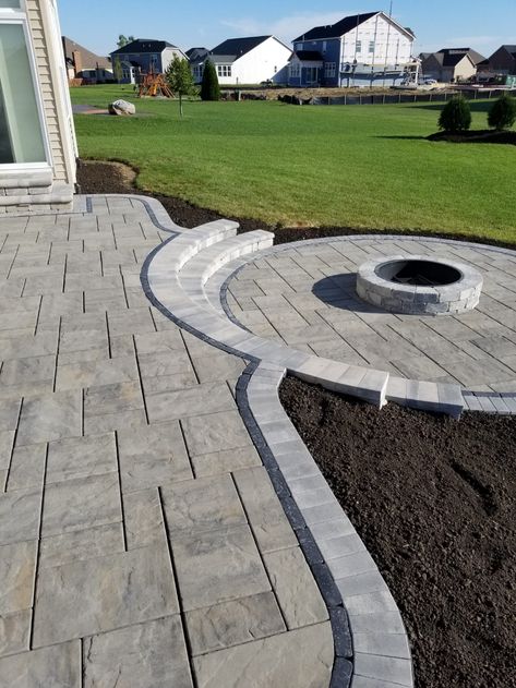 Square Patio With Round Fire Pit, Stamped Concrete Patio With Fire Pit, Raised Stone Patio, Patio Paver Designs Layout, Backyard Paver Ideas, Raised Fire Pit, Paver Patio With Fire Pit, Wrap Around Patio, Paver Patio Ideas