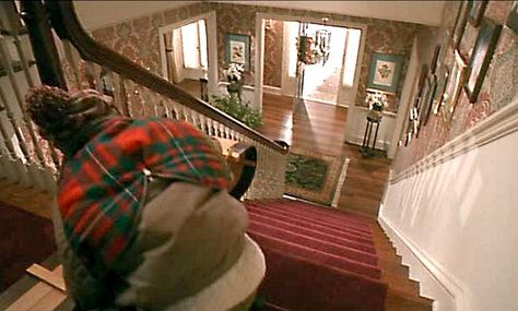 Kevin sledding downstairs in Home Alone movie Kevin Alone At Home, Home Alone House, Home Alone 1, Winnetka Illinois, Watch Home Alone, Double Island Kitchen, Home Alone Movie, Home Alone Christmas, Built In Banquette