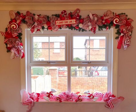 Christmas Decor Display, Frame Fireplace, Candy Themed Christmas, Window Garland, Giant Candy Cane, Christmas Lollipops, Porch Fireplace, American Giant, Christmas Campaign