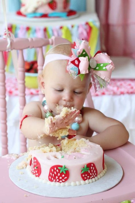 Strawberry Smash cake.  Note the cute headband and necklace - no shirt to help with the mess!  Love it. Sweet One Strawberry Smash Cake, Smash Cake Strawberry Theme, Strawberry First Birthday Cake Smash, Berry Sweet One First Birthday Smash Cake, Strawberry Birthday Smash Cake, Berry Sweet 1st Birthday Smash Cake, Smash Cake Strawberry First Birthdays, Berry Themed First Birthday Cake, Strawberry Theme Smash Cake