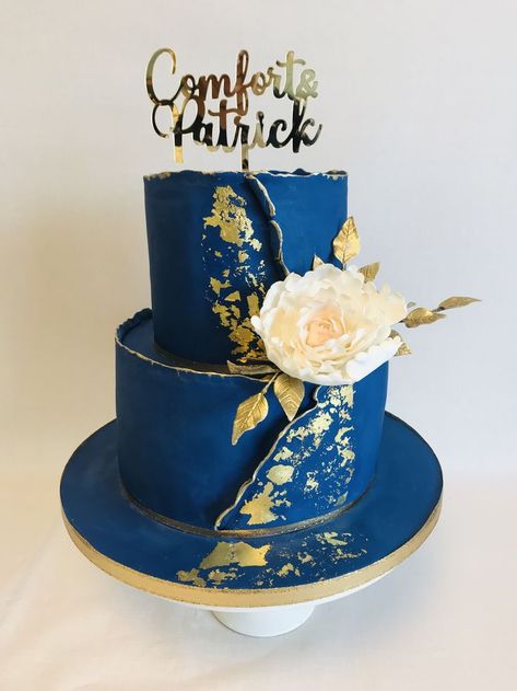 Comfort, 2 tier royal blue and gold theme wedding cake with statement sugar peony spray and personalised topper Lobola Cake Ideas, Royal Blue And Gold Cake, Blue And Gold Wedding Cake, Blue And Gold Cake, Gold Theme Wedding, Royal Blue Wedding Cakes, Royal Blue Cake, Art Deco Wedding Cake, 2 Tier Wedding Cakes