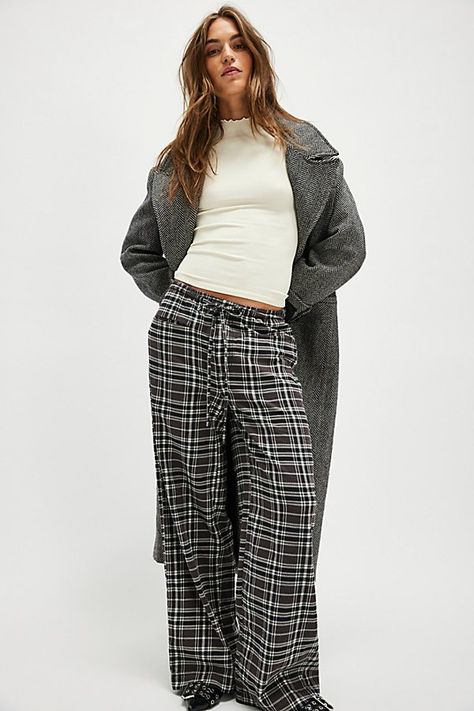 A perfectly plaid version of our Hudson Canyon Stripe Pants, this slouchy pair is featured in a high-rise fit and wide-leg style with a drawstring waistband. **Fit:** High-rise; wide, full-length legs **Features:** Soft cotton fabrication with wide plaid print throughout, adjustable drawstring waistband, pockets for hands, back-pocket detail **Why We ❤ It:** These billowy pants pair perfectly with your favorite tank and strappy sandals. | Hudson Canyon Plaid Pants by Free People in Black, Size: Plaid Cargo Pants Outfit, Casual Plaid Pants Outfit, Plaid Pants Outfit Winter, Plaid Cargo Pants, Wide Leg Plaid Pants, Pajama Pants Outfit, Thrift List, Plaid Pants Outfit, Winter Pants Outfit