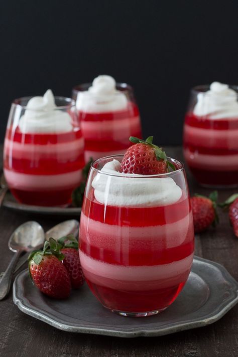 Layered Strawberry Jello Cups - a fun jello dessert to make for Valentine’s Day! Strawberry Jello Cups, Jello Cups, Jello Desserts, Parfait Recipes, Strawberry Jello, Valentine Desserts, Jello Recipes, Valentines Day Desserts, Valentines Day Food