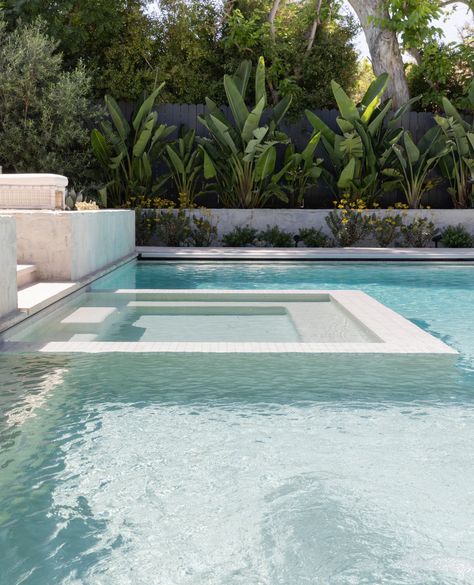 The stunning salt water pool at our #gsdxsantiagoparadise project features a modern infinity edge plunge spa, visually merging the two boundaries into one. Languid afternoons spent pool-side are just within reach, and boy does this scene have us feelin' ready to dive in!👙⁠ ⁠ _________________________⁠ ⁠ Project: #gsdxsantiagoparadise  ⁠ Landsape Build: @dig_landscapeconstruction⁠ Interior: @prairie_interiors ⁠ Photo: @rileystarrphoto Infinity Edge Spa In Pool, Modern Pool With Hot Tub, Infinity Pool Design Ideas, White Waterline Tile Pool, Rectangular Pool Landscaping, Pool Water Feature Wall, All White Pool, Alamo Project, Modern Pool Ideas