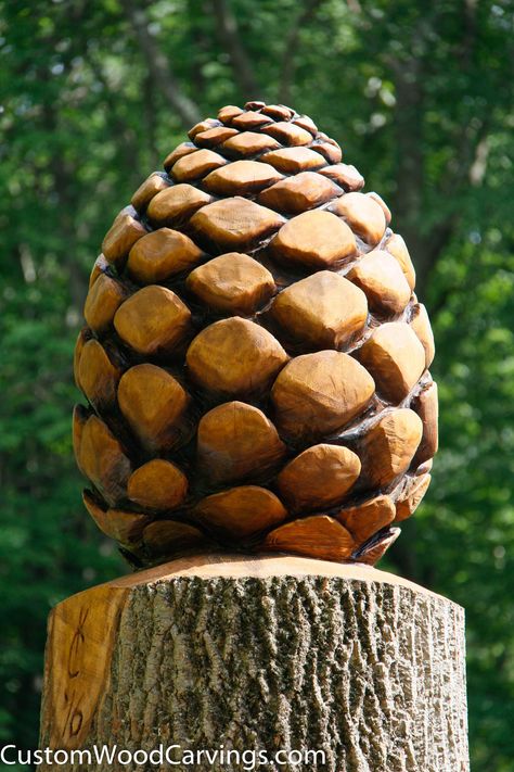 Carved pine cone Pine Cone Wood Carving, Carving Trees In Wood, Tree Stump Carvings Chainsaw, Carved Tree Stump, Chainsaw Mushroom Carving, Giant Pine Cones, Chainsaw Wood Carving, Tre Kunst, Carved Tree Stump Sculptures & Statues