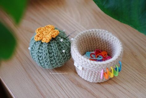 Pom 🌱 Crochet Genshin Friends! on Instagram: "This cactus pin cushion with a secret stitch marker holder is, surprisingly, one of the most useful things I’ve made this year! I’ve been using it for two things: (1) a new Genshin pattern I’m designing (coming soon!!) and (2) sewing! i’m terrible about leaving stitch markers in every nook and cranny, so it’s been super helpful to have a home for them. plus, the pin cushion also keeps my tapestry needles in one place and just makes the perfect hub Crochet Pin Holder Free Pattern, Pincushion Crochet Free Pattern, Crochet Cactus Pin Cushion Free Pattern, Crochet Cupcake Pin Cushion, Crochet Sewing Pin Cushion, Crochet Marker Holder, Crochet Cactus Pin Cushion, Crochet Stitch Marker Holder, Stash Jar Crochet Pattern