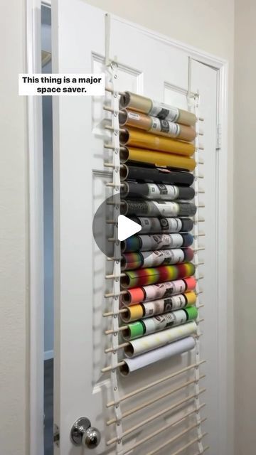 Megan Meketa • Crafting Tutorials on Instagram: "Let’s chat vinyl storage!! 📦💕 This is the craft room vinyl organizer from my friend Renee, @crafterscreek!! It can hold 25 rolls of vinyl and transfer tape and can be hung on the back of a door or on a wall. Major space saver!! It’s the perfect way for me to store my @teckwrapcraft vinyl rolls and transfer tape!! 👌✨ #craftstagram #happycrafting #ilovecrafting #lovecrafting #lovetocraft #craftlover #craftsupplies #craftingcommunity #craftstorage #craftingtools #crafttools #vinylstorage #craftroomorganization #smallcraftbusiness #craftroomstorage #cricut #heattransfervinyl #htvvinyl #teckwrapcraft" Vinyl Rolls Storage Ideas, How To Organize Vinyl Rolls, Circuit Vinyl Storage, Ways To Store Vinyl Rolls, Vinyl Craft Storage, Storing Cricut Vinyl Rolls, Storing Vinyl Rolls, Cricut Roll Storage, Diy Vinyl Roll Storage