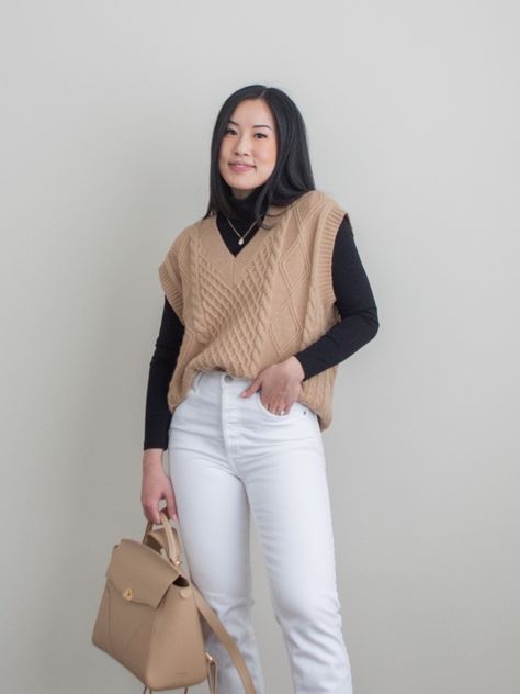 Her Simple Sole detailed outift photo featuring camel knit sweater vest layered over a black turtleneck top, white straight leg jeans, black chunky combat boots, Oleada Wavia bag in Champagne Sweater Vest Inspo Outfits, Tan Sweater Vest Outfits For Women, Women Sweater Vest Outfit, Sweater Vest Work Outfit, Turtleneck Vest Outfit, Business Casual Sweater Vest, Black Turtleneck Outfit Layering, Smart Casual Outfits For Women, Turtleneck Outfit Layering