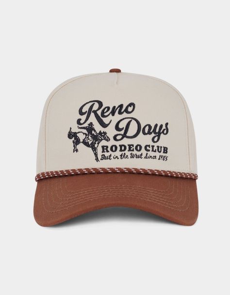 Reno Days Snapback Hat. 5-Panel Structured Hat. Embroidery On Front. Braided Rope Across Curved Visor. Adjustable Snap Closure. 100% Cotton. Imported. Vintage Western Hats, Vintage Snapback Hats, Lane Frost Hat, Brown Trucker Hat With Patches, Western Trucker Hat, Embroidered Trucker Hats, Western Trucker Hats, Western Wishlist, Trucker Hat Designs