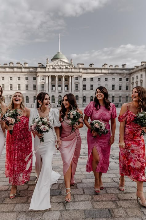 Bride with bridesmaids in mismatched bridesmaid dresses in different styles and patterns for contemporary city wedding Bridesmaids Ankle Length Bridesmaid Dresses, Dresses Patterned, Pink Bridesmaid Dresses Mismatched, Bridesmaid Dresses Different Colors, Patterned Bridesmaid, Mismatched Dresses, Patterned Bridesmaid Dresses, Pink Bridesmaids, Bridesmaids Dress Inspiration