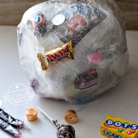 Candy Ball Game, Family Easter Games, Saran Wrap Ball Game, Willy Wonka Party, Fun Halloween Party Games, Thanksgiving Games For Kids, Fun Christmas Party Games, Candy Balls, Candy Games