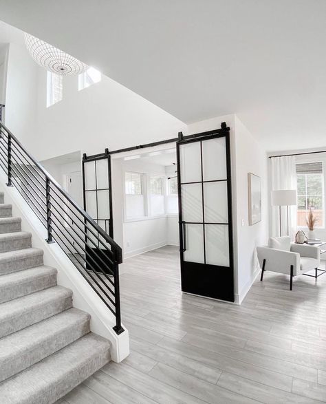 Black Barn Doors, Barn Doors With Glass, White Foyer, Terrace Renovation, Double Sliding Barn Doors, White Wood Floors, Entryway Design, Grey Wood Floors, Barn Door Designs