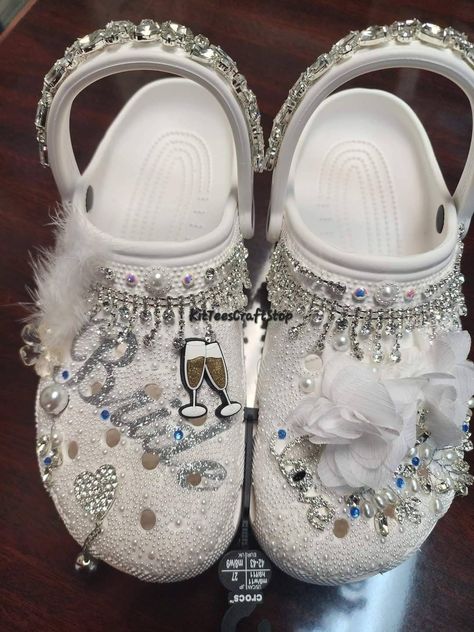 Custom crocs for your special wedding day! Fully customizable shoes for the bride or bridal party. These crocs are also great for birthdays, proms, concerts, and Quinceañeras!  We customize the top of the shoe and ankle band covered with pearls, crystals, glitter vinyl, and rhinestones. These crocs are most definitely a show stopper! Simply choose your size and color, and then we will handle the rest. We have a 1 - 2 Week Turnaround depending on if we have your size in stock, so please communicate if you have an immediate deadline. Wedding Crocs For Bride, Bride Crocs, Bridal Crocs, Wedding Crocs, Crocs Custom, Shoes For The Bride, Black Lace Wedding Dress, Black Lace Wedding, Bedazzled Shoes