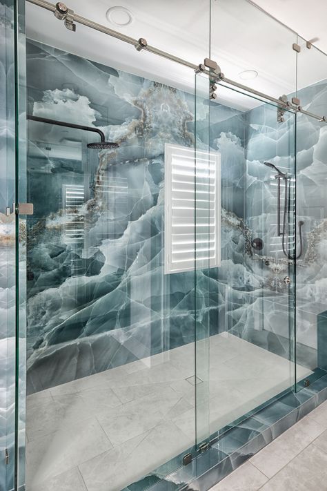 Standing shower in a bathroom remodel with blue marble and stainless steel decor Onyx Bathroom Ideas, Onyx Tile Bathroom, Blue Marble Bathroom, Stainless Steel Decor, Marble Bathroom Decor, Steel Decor, Outdoor Interior, Crystal Bathroom, Bathroom Design Styles