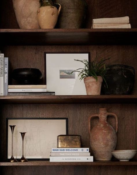 24 Dark and Moody Shelf Decor Ideas » Lady Decluttered Styling Dark Shelves Living Room, Rustic Shelf Styling, Narrow Shelves Decor, Dark Wood Bookshelf Styling, Moody Corner Decor, Dinning Room Shelf Decorations Ideas, Styling Dark Shelves, Decorate Shelf Living Room, Dark Wood Built Ins Living Room