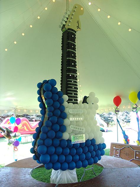 Wow, probably not in the budget, but really cool! Guitar Balloon Sculpture, Balloon Themed Birthday Party, Balloon Distortion, Music Birthday Cakes, Guitar Party, Hero Birthday Party, Music Birthday Party, Rock Star Birthday, Rockstar Birthday Party