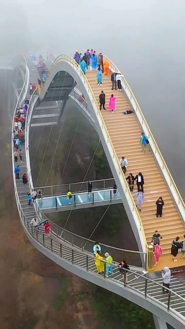 Epic World on Instagram: "CRAZY 140 m high bending glass bridge in #China . Many think this bridge is too dangerous to exist, what do you think? . 📍 Ruyi bridge located in China’s Zhejiang province . #adrenaline #relaxing #beautifuldestinations #globe #travelchina #nature #architecture #engenering #travelgram" Ruyi Bridge China, Ruyi Bridge, Walking Bridge, Glass Bridge, Famous Bridges, Bridge Over Troubled Water, Nature Architecture, Arch Bridge, Bridge Design