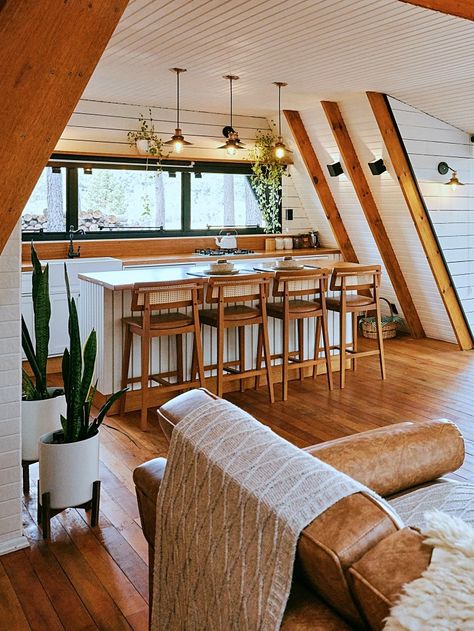 Cozy A-Frame Cabin: A Charming Retreat Nestled in Nature’s Embrace - A Frame Home Decor, Half A Frame Cabin, A Frame Cabin Living Room, A Frame House Decorating Ideas, A Frame House Interior Layout, Modern A Frame Interior, A Frame Extension, A Frame Renovation, Micro A Frame Cabin