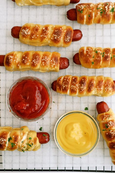 pretzel dogs on a cooling wrack with ketchup and mustard Pretzel Dog Recipe, What To Serve With Chili, Pretzel Dogs Recipe, Serve With Chili, Pretzel Dog, New York Dog, Pretzel Dogs, York Dog, Frozen Rolls