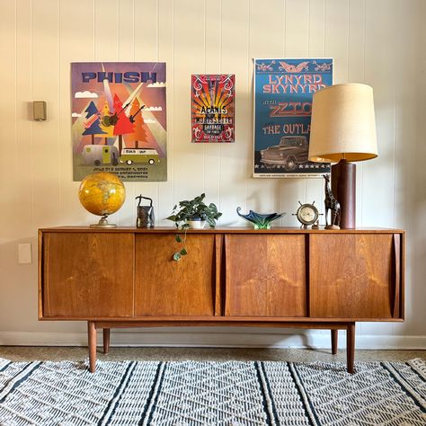 Mid-Century Teak Sideboard by S.T.M. Møbler This stunning mid-century modern teak sideboard is a timeless piece designed by S.T.M. Møbler. Crafted from high-quality teak, it features clean lines and a minimalist aesthetic characteristic of Scandinavian design. The rich, warm tones of the wood add a touch of elegance, making it a perfect fit for any living or dining space. The sideboard offers ample storage with four sleek doors that seamlessly blend into the design, providing space for your esse Teak Sideboard Living Room, Teak Console Table, Mid Century Scandinavian Living Rooms, Mid Century Decorating Ideas, Mcm Credenza, Townhome Decor, Living Room Mid Century Modern, Mcm Bedroom, Sideboard Ideas