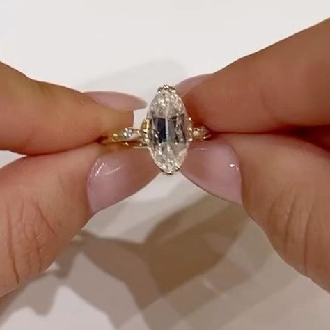 EAST WEST GEM CO. // on Instagram: "An old mine moval cut in our Harlow Setting is never not stunning, specifically with this combo of upgrades that this client added! This includes a donut, invisible halo, pavé bridge and marquise accent side stones. -————————— #EASTWESTHARLOW - 4.85 carats (1.89 ratio) - 13.75x6.25mm old mine moval, vintage white moissanite center set in a 14k yellow gold setting - $3,775 (as shown) 💵 Or as low as $131.53 a month with Bread Pay* 🤚🏻 Shown on a size 4.5 finger" Old Mine Cut Moval Engagement Ring, Old Mine Moval Cut, Old Mine Moval Engagement Ring, Marquise Oval Engagement Ring, Moval Engagement Ring, Old Mine Cut Engagement Ring, Diamon Ring, East West Gem Co, East West Marquise