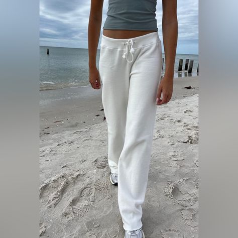 Nwt. No Flaws Or Callouts. Lowrise Thick And Cozy Cotton Sweatpants With A Drawstring Waist, And Flared Legs With A Raw Hem. Fabrics: 100% Cotton Measurements: Waist 28" (71 Cm), Rise 9" (23 Cm), Inseam 32" (81 Cm) Made In: China Brandy Melville Bottoms, Brandy Melville Anastasia Sweatpants, Brandy Sweats, Brandy Sweatpants, Brandy Melville Clothes, Brandy Melville Sweatpants, Flare Sweatpants, Thrift Wishlist, Sweatpants White