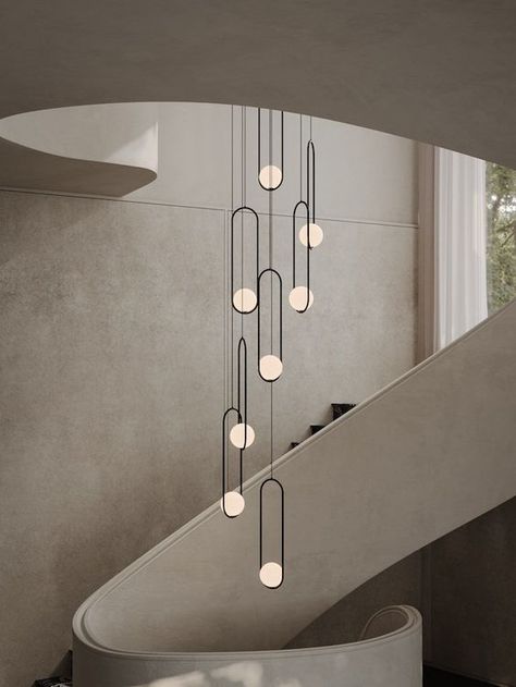 Stairs Chandelier Modern, Pendant Lighting Hallway Stairs, Mezzanine Lighting Ideas, Modern Stairwell Lighting, Staircase Pendant Lights, Light Fixture Stairwell, Modern Stair Chandelier, Staircase Chandelier Modern Farmhouse, Long Hanging Lights Stairs