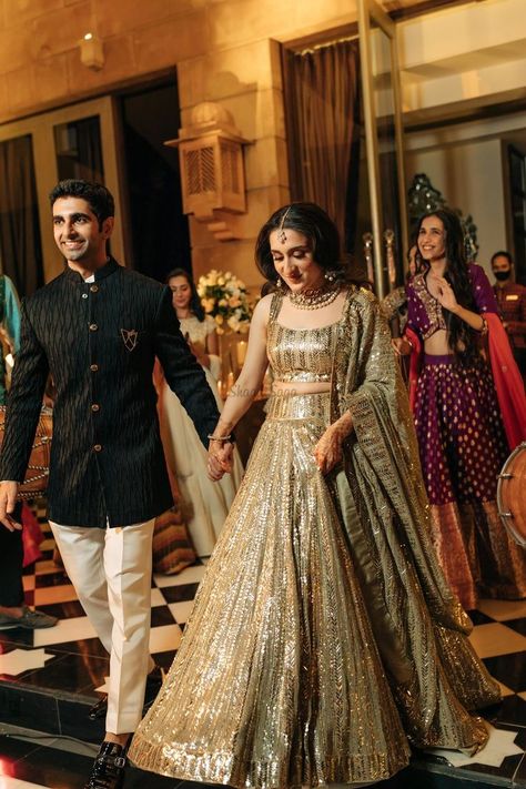 Presenting you latest Indian Sangeet Night Outfit ideas for Bride & Groom. From bridal gowns to bridal indo western outfits, we have got variety of sangeet outfits. #shaadisaga #indianwedding #sangeetoutfit #sangeetoutfitbridal #sangeetoutfitformen #sangeetoutfitbridalindowestern #sangeetoutfitbridalgown #sangeetoutfitforbride #sangeetoutfitideas #sangeetoutfitbridalunique #sangeetoutfitpunjabi #sangeetlehenga #sangeetlehengaforbride #sangeetlehengabridal #sangeetlehengadesigner #sangeetgown Sangeet Outfit Bridal, Indian Engagement Outfit, Indian Reception Outfit, Lehenga For Engagement, Engagement Dress For Groom, Wedding Matching Outfits, Udaipur Wedding, Engagement Dress For Bride, Engagement Lehenga