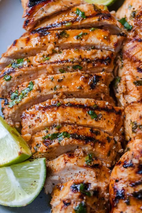 An EASY recipe for grilled Cilantro Lime Chicken, with a 5-minute prep time. The cilantro lime chicken marinade makes juicy, tender chicken. Cilantro Marinade Chicken, Sides For Cilantro Lime Chicken, Cilantro Lime Marinade Chicken, Cilantro Chicken Recipes, Chicken Cilantro Recipes, Fiesta Lime Chicken Recipe, Key Lime Chicken, Lime Cilantro Chicken, Grilled Cilantro Lime Chicken