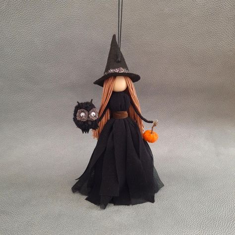 Every Halloween decoration should have at least one pretty witch doll! This beautiful witch will protect your home from evil spirits. She will bring a good magic wherever you place her- indoor your house, car or office. This Halloween ornament is handmade with attention to the smallest details - mini cute owl and pumpkin make the doll unique. It comes beautifully packaged,ready for gifting. Made of fabric, felt, yarn, cotton thread,wooden bead. Witch length:20 cm/ 8 in approx. Total length:31 cm Witch Crafts Diy, Witch For Halloween, Kitchen Witch Doll, Book Witch, Pretty Witch, Felt Witch Hat, Halloween Brooms, Halloween Witch Dolls, Hanging Witch