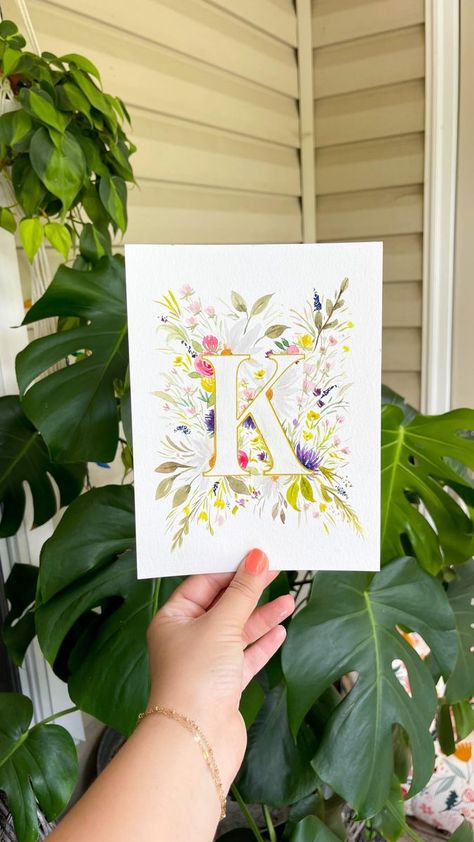 The letter “K” was probably the most popular request! This original painting has sold, but there are still prints available 🤍 Tag your favorite person whose name starts with a “K” 💕 @princetonbrush velvet touch round size 4 brush @cansonpaper xl @pebeo masking fluid @uniballco signo gold pen ‼️Stencils and supplies are linked in my profile #watercolorflowers #monogram #arttherapy #watercolorpainting #negativespace | februaryrosedesigns | Roman Nagel · Passacaglia Watercolor Names, Letter Watercolor, Name Starts With A, Names Starting With A, K Letter, The Letter K, Gold Pen, Letter K, Drawing Artwork