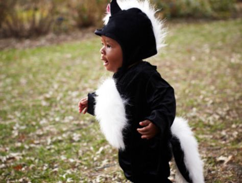 These Absolutely Adorable Kid Halloween Costumes Are Guaranteed to Make You Smile. | ESSENCE.com Toddler Skunk Costume, Best Baby Costumes, Baby Skunk Costume, All Black Halloween Costume, Diy Baby Halloween Costumes, Skunk Costume, Baby Skunk, Black Dress Halloween Costume