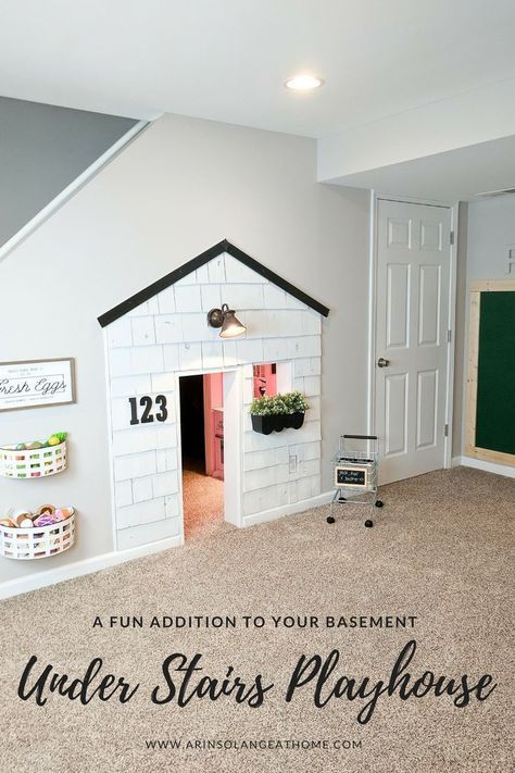 A fun addition to our basement has been this playhouse under the stairs. It is 3 full rooms, and complete with electricity. The update with cedar shake shingles is up on the blog, so be sure to check it out! https://www.arinsolangeathome.com #playhouse #diy #understairsplayhouse Under Stairs Playhouse, Under Stairs Playroom, Under Stairs Dog House, Room Under Stairs, Diy Playhouse, Basement Playroom, Basement Walls, Dog Rooms, Understairs Storage