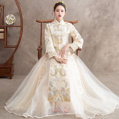 Looking for a fascinating beautiful Champagne Tradtional Chinese Wedding Dress Qun Kwa 裙褂? ＊＊This Qun Kwa is a very stunning traditional Chinese wedding gown with Embroidered Dragon and Phoneix.  If you are looking for an unique design Qun Kwa, then this dress is very suitable for you. Size: S,M,L,XL,2XL Features: 3/4 sleeve, mandarin collar,  red color Chinese Wedding dress Occasion: Wedding, Ceremony, Event, Party, Celebration, Anniversary If you have any questions, please feel free to contact Champagne Gold Wedding Dress, Qun Kwa, Vestido Charro, Chinese Wedding Dress Traditional, Wedding Qipao, Chinese Bride, Traditional Chinese Wedding, Gown Gold, Chinese Wedding Dress